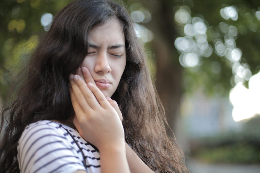 Shallow focus photo of woman in white and black stripe shirt